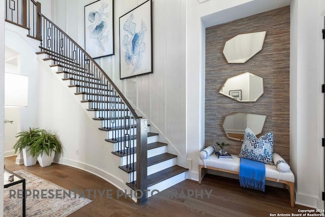 staircase featuring wood-type flooring