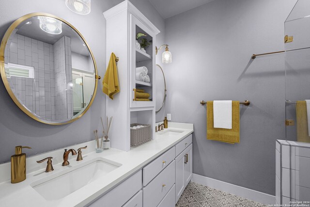 653 Center Grn, New Braunfels, TX 78130 - bathroom featuring tile patterned floors, vanity, and tiled shower