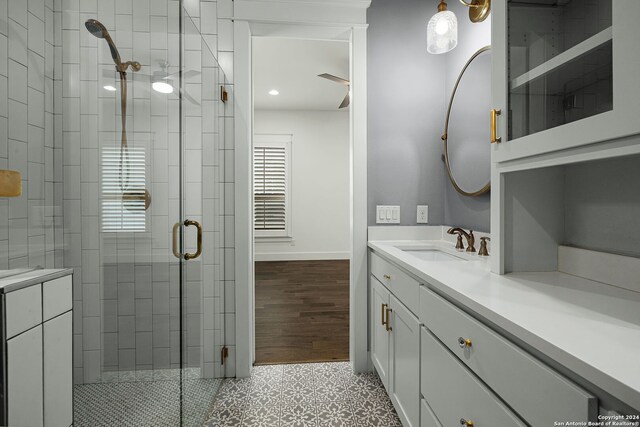 653 Center Grn, New Braunfels, TX 78130 - bathroom with tile patterned flooring, vanity, and a shower with shower door
