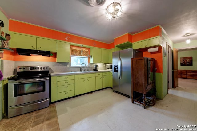 kitchen with stainless steel appliances, tasteful backsplash, and sink