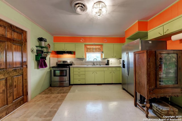 kitchen with backsplash, electric stove, sink, green cabinetry, and ornamental molding