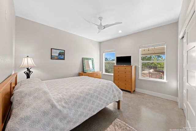 bedroom featuring ceiling fan and a closet