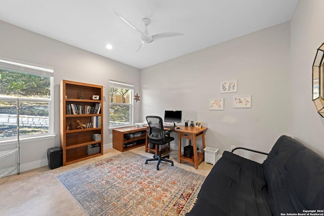 home office with ceiling fan and plenty of natural light