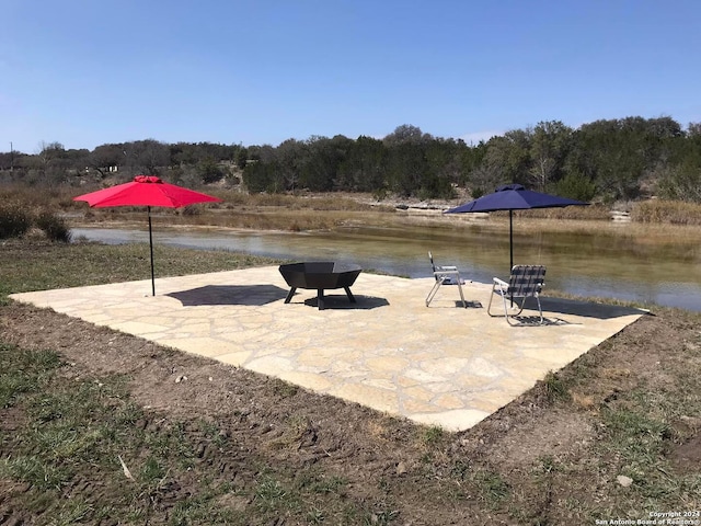 view of patio featuring a water view