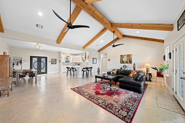 living room featuring beam ceiling, french doors, high vaulted ceiling, and ceiling fan with notable chandelier