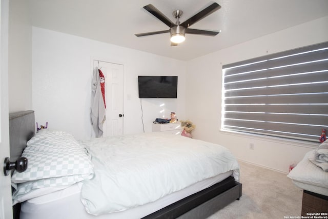 carpeted bedroom featuring ceiling fan