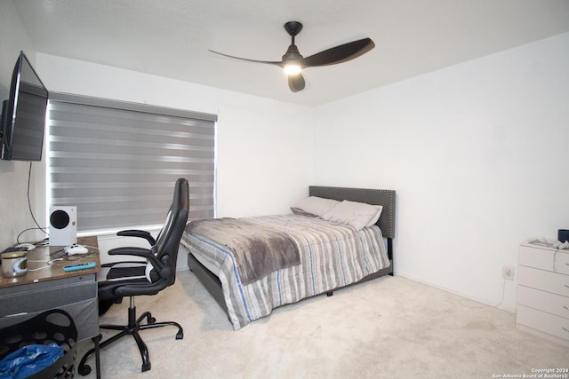 bedroom with light carpet and ceiling fan