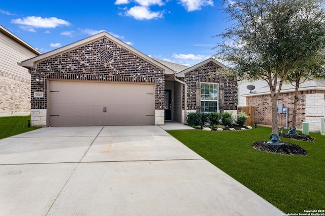 view of front of property featuring a front yard, brick siding, driveway, and an attached garage