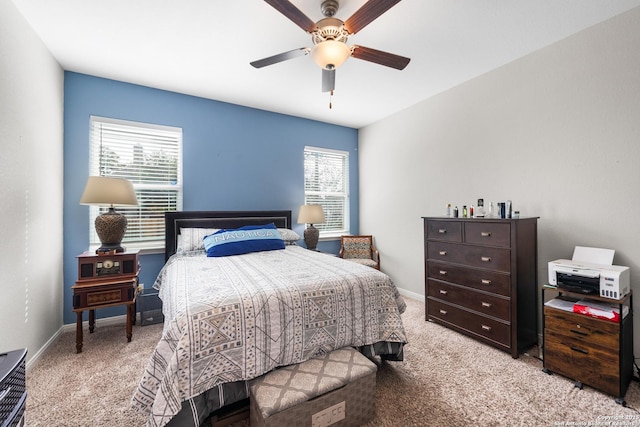 bedroom featuring light carpet, ceiling fan, and baseboards