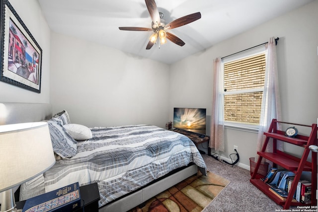 carpeted bedroom featuring a ceiling fan and baseboards