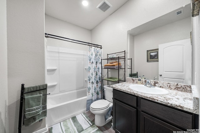 bathroom with toilet, shower / bath combo, visible vents, and vanity