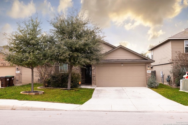 view of front facade featuring a front yard and a garage