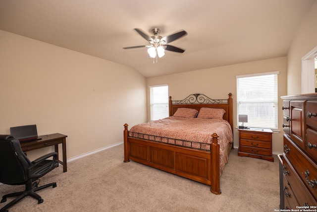 carpeted bedroom with ceiling fan and lofted ceiling