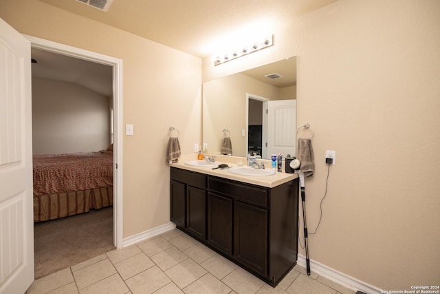 bathroom featuring tile patterned floors and vanity