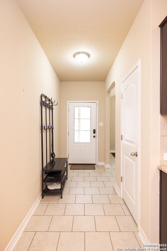 entryway featuring light tile patterned flooring