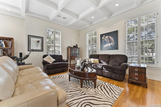 living room with beamed ceiling, light wood-type flooring, and coffered ceiling