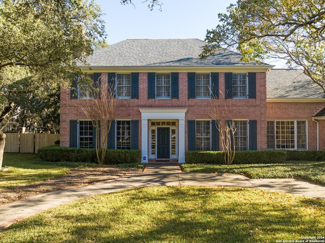 colonial house with a front lawn