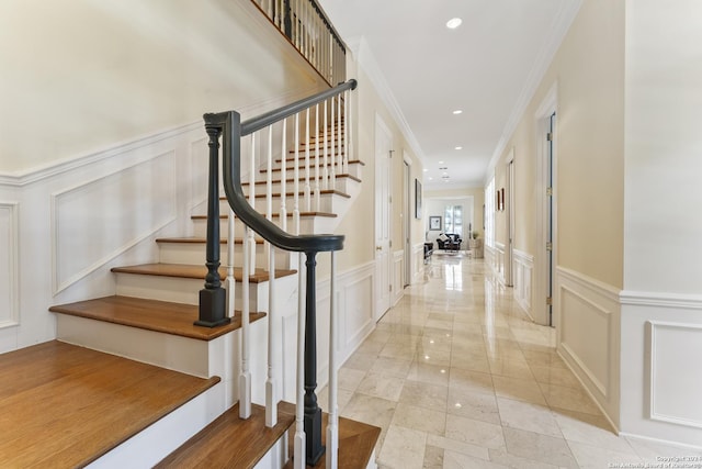 staircase with crown molding