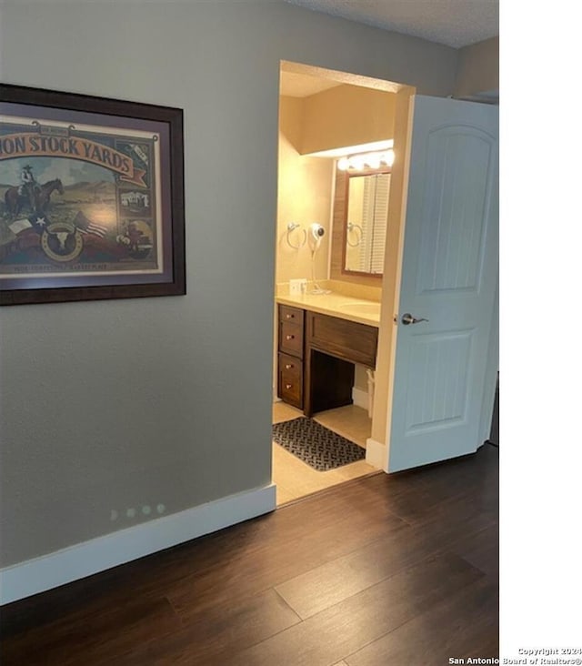 bathroom with vanity and wood-type flooring