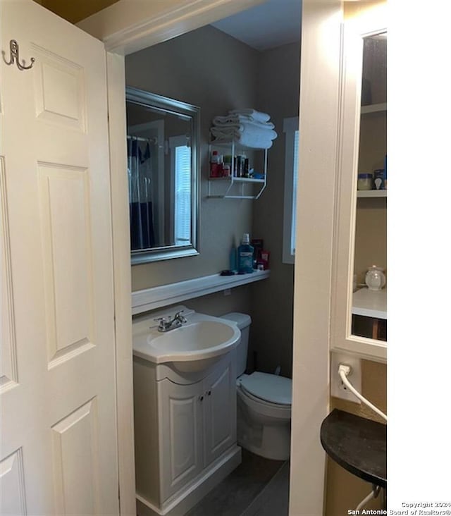 bathroom with vanity and toilet