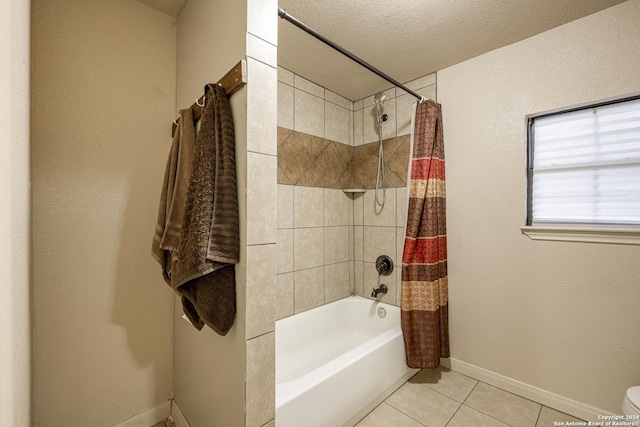 bathroom featuring tile patterned floors, toilet, a textured ceiling, and shower / tub combo