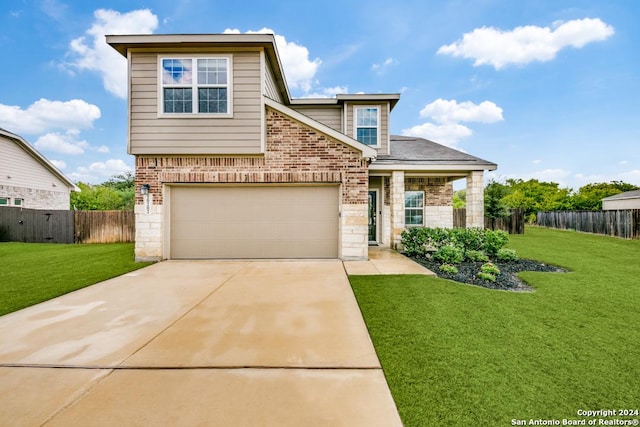 view of front of house featuring a garage and a front yard