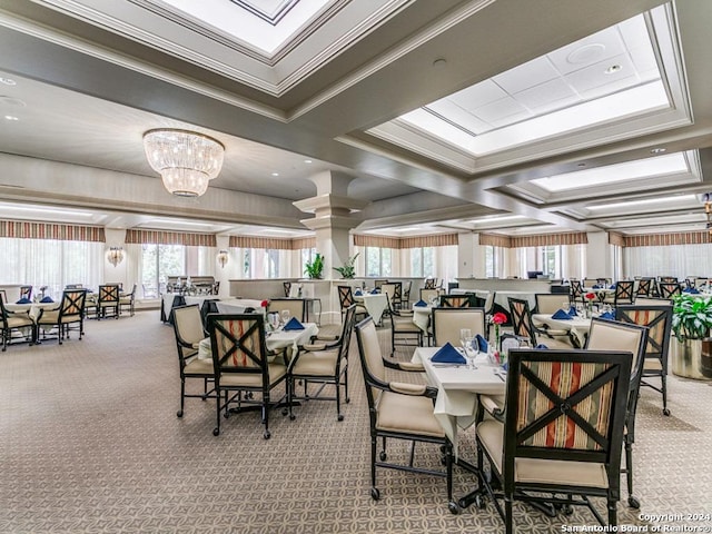 carpeted dining area featuring crown molding and a chandelier