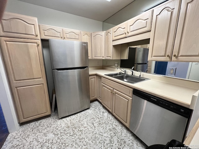 kitchen featuring sink, light brown cabinets, and appliances with stainless steel finishes