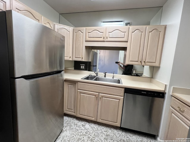 kitchen with sink, light brown cabinets, and appliances with stainless steel finishes