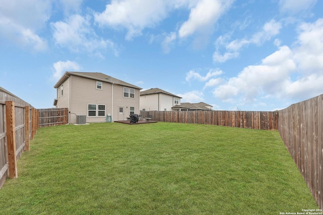 view of yard with central AC