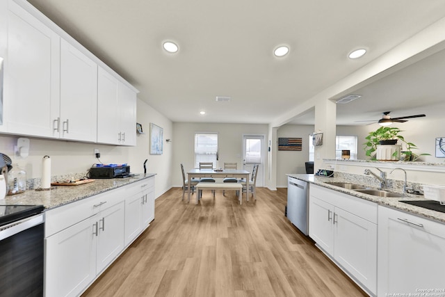 kitchen with ceiling fan, sink, stainless steel appliances, light hardwood / wood-style flooring, and white cabinets