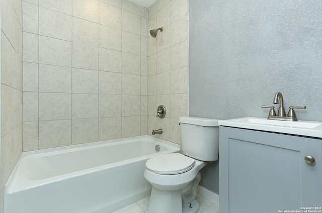 full bathroom featuring vanity, tiled shower / bath combo, and toilet