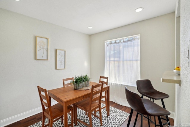 dining space with dark wood-type flooring