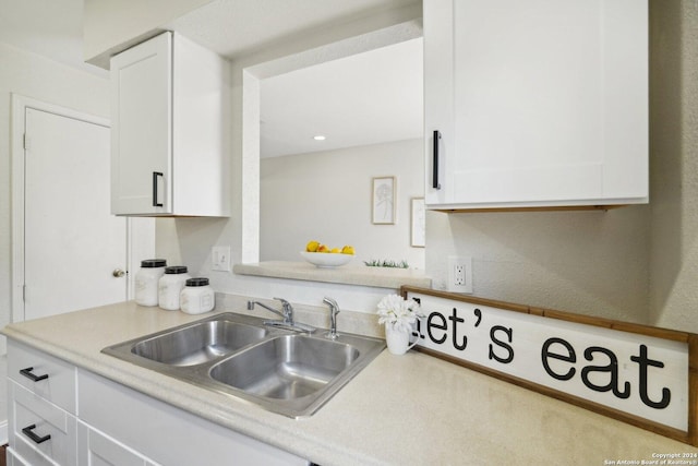 kitchen with white cabinets and sink