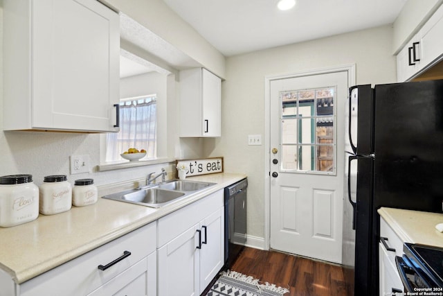 kitchen featuring dark wood-type flooring, sink, white cabinets, and black appliances