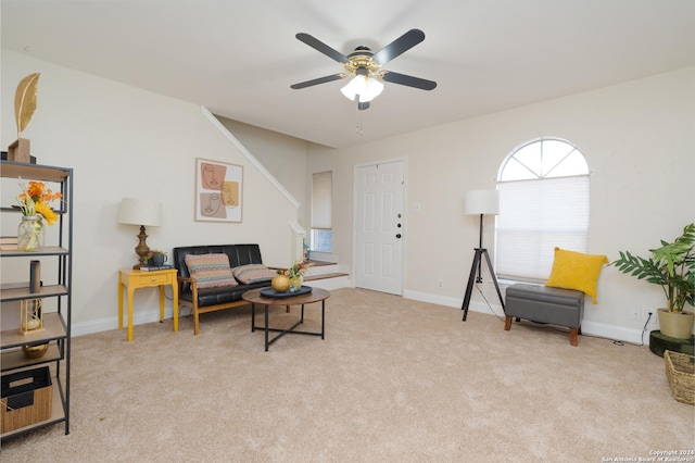 carpeted living room featuring ceiling fan