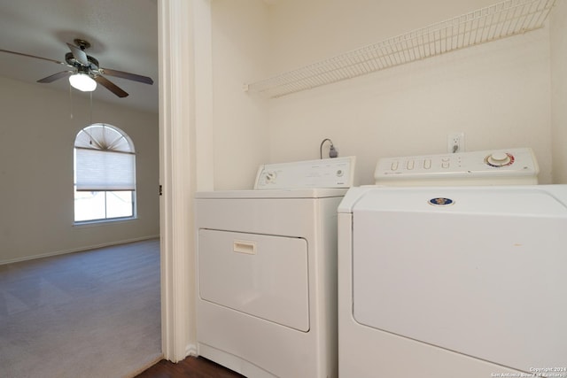 clothes washing area with dark colored carpet, ceiling fan, and washing machine and clothes dryer