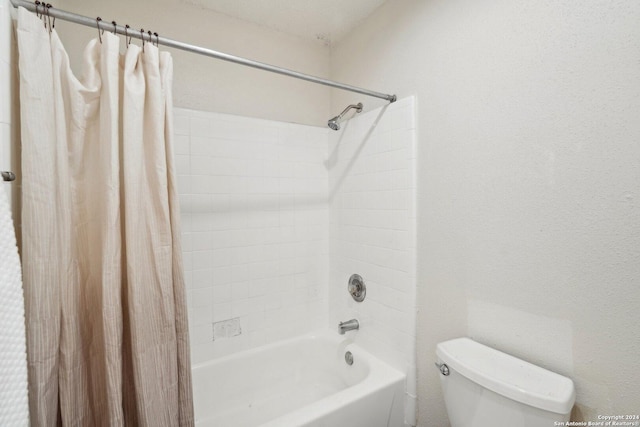 bathroom featuring shower / bath combination with curtain and toilet