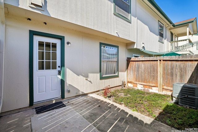 doorway to property featuring cooling unit