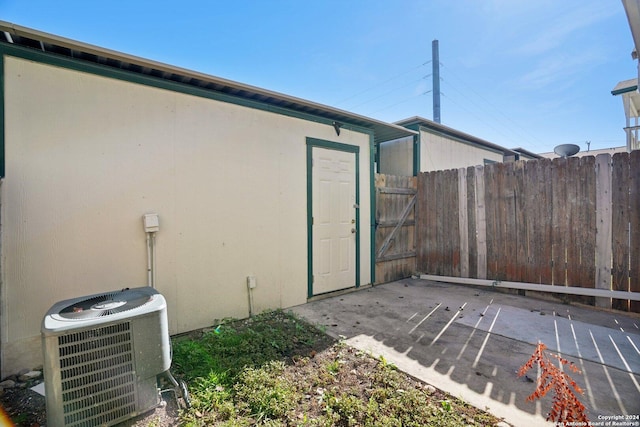 exterior space with a patio area and cooling unit