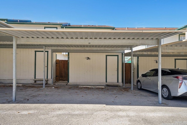 garage featuring a carport