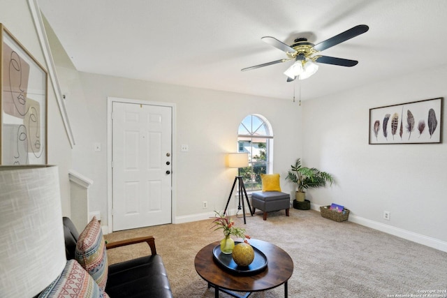 living room with carpet flooring and ceiling fan