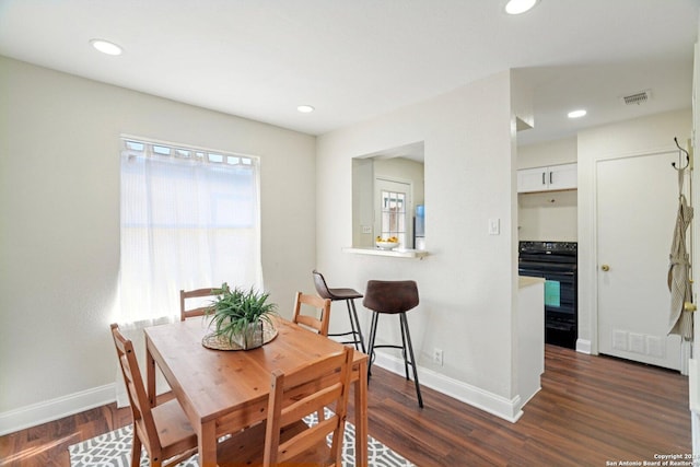 dining area featuring dark hardwood / wood-style flooring