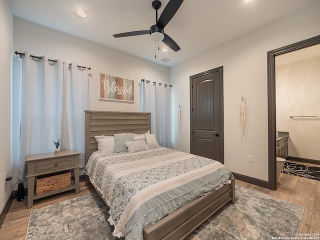 bedroom with light hardwood / wood-style flooring and ceiling fan