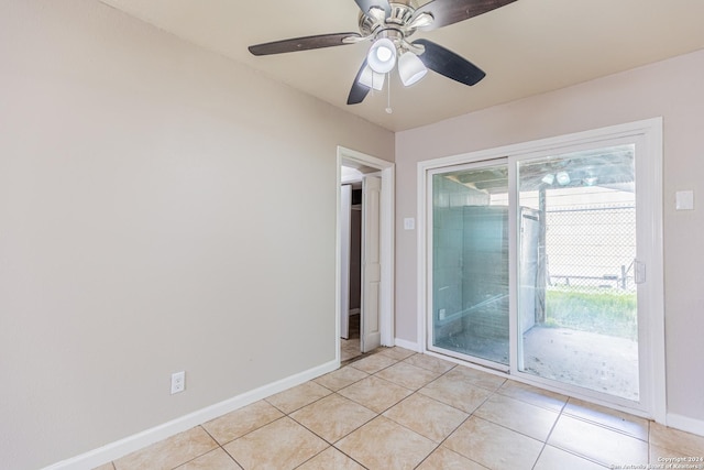 tiled empty room with ceiling fan