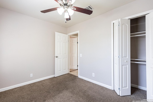 unfurnished bedroom with ceiling fan and carpet floors