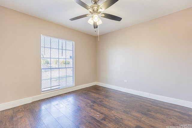 spare room with ceiling fan and dark hardwood / wood-style floors