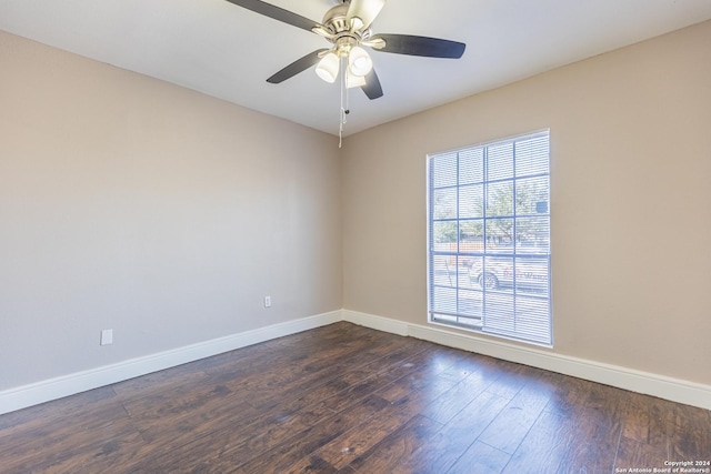 spare room with ceiling fan and dark hardwood / wood-style flooring