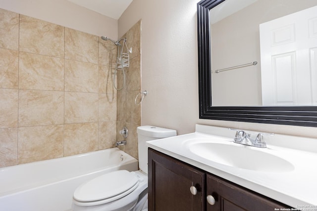 full bathroom featuring vanity, toilet, and tiled shower / bath