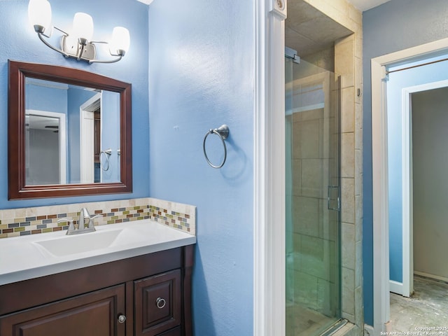 bathroom with tasteful backsplash, vanity, and walk in shower